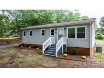 Charming one-story home with newly landscaped front yard and inviting entrance at 2980 N Church St, Claremont, NC 28610