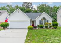 Charming single-Gathering home featuring a well-manicured lawn, two-car garage, and inviting curb appeal at 199 Ashmont Dr, Kannapolis, NC 28081