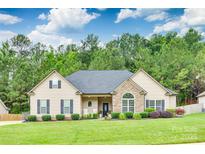Charming single-story home with manicured lawn, stone accents, and welcoming front porch at 268 Hillsborough Ln, Rock Hill, SC 29732