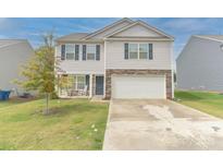 Charming two-story home with vinyl siding, stone accents, and a two-car garage at 2859 Sherrills Stream Dr, Sherrills Ford, NC 28673