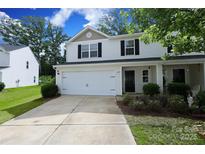 Two-story home with a white exterior, black shutters, an attached garage, and a well-manicured front lawn at 3349 Ellingford Rd, Charlotte, NC 28214