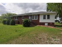 Charming single-story brick home featuring a well-maintained lawn and front garden at 3505 Valley Dr, Chester, SC 29706