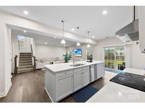 Modern kitchen with an island, stainless steel appliances, and an open layout to the Gathering room at 1022 Hinson Forest Rd, Monroe, NC 28110