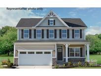 Charming two-story home with a two-car garage and craftsman style front door at 2024 Bramble Hedge Rd # 3275, Indian Trail, NC 28079