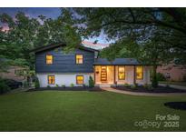 Charming two-story home with a beautifully landscaped yard and inviting exterior at 3326 Winterfield Pl, Charlotte, NC 28205