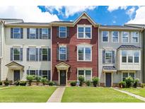 Charming townhouse with well-manicured lawn, lush landscaping and inviting curb appeal at 4060 Zilker Park Dr, Charlotte, NC 28217