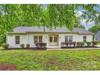 Charming brick ranch home with a well-manicured lawn and tidy landscaping at 4633 Cringle Ct, Charlotte, NC 28226