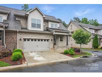 Charming two-story home features a two-car garage, brick facade, and meticulously maintained landscaping at 5118 Waldron Meadow Dr, Charlotte, NC 28226