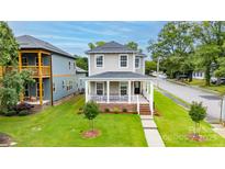 Charming two-story home with inviting front porch and landscaped yard at 517 E Main St, Rock Hill, SC 29730