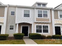 Charming townhouse with neutral siding and a well-maintained front yard at 13441 Calloway Glen Dr, Charlotte, NC 28273