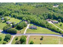 Aerial view of home on large lot outlined in blue at 136 Barringer Dr, Statesville, NC 28625