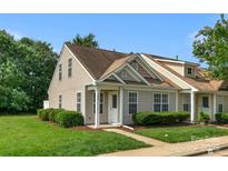 Charming home featuring light siding, well-manicured lawn, and tasteful landscaping at 1907 Sandal Brook Rd, Fort Mill, SC 29707
