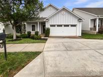 Charming one-story home featuring a light gray exterior, well-manicured landscaping, and an attached two-car garage at 27415 Cinderella Cir, Lancaster, SC 29720
