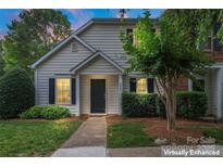 Charming home featuring a well-maintained lawn, a black door, and tasteful shrubbery at 945 Heritage Pkwy, Fort Mill, SC 29715