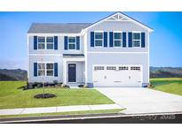 Charming two-story home featuring blue accents, a two-car garage, and a well-maintained front lawn at 12109 Beaux Art Ln, Charlotte, NC 28214