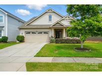 Charming one-story home with attached garage and well-maintained lawn, offering great curb appeal at 16213 Kelby Cv, Charlotte, NC 28278