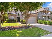 Charming home featuring a stone and vinyl exterior, well-manicured lawn, and a two-car garage at 4121 Cedar Point Ave # 28, Stallings, NC 28104