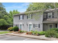 Charming gray two-story condo with a landscaped front yard and beautiful curb appeal at 6101 Heath Ridge Ct, Charlotte, NC 28210
