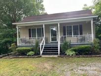 Charming single-story home with a covered porch and well-maintained landscaping at 114 Wayne Ave, Kannapolis, NC 28081
