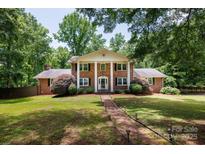 Traditional two-story brick home with white columns and inviting brick pathway at 2605 Camelot Dr, Rock Hill, SC 29732