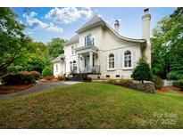 Stately two-story traditional home featuring a manicured front lawn and multiple windows with white shutters at 2972 Kaneland Ct, Rock Hill, SC 29732