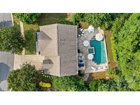 Stunning aerial view of home with luxurious pool, hot tub, and outdoor entertaining area surrounded by lush landscaping at 362 Windell Dr # 67, Fort Mill, SC 29708