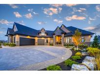 Beautiful home with a stone and stucco exterior, manicured landscaping, and an expansive driveway at 0 Edgewater Dr # 107, Norwood, NC 28128