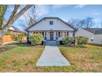 Charming home featuring a covered porch and inviting front yard landscape at 1003 S Ridge Ave, Kannapolis, NC 28083