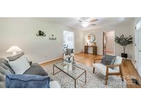 Comfortable living room with hardwood floors, ceiling fan, stylish furnishings, and neutral decor at 1188 Rainbow Cir, Catawba, SC 29704