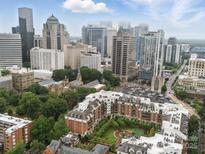 Expansive aerial view of urban condo with stunning city skyline backdrop and manicured courtyard at 300 W 5Th St # 339, Charlotte, NC 28202