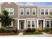 Charming townhome with neutral siding, well-maintained landscaping, and inviting entryway at 512 Morrows Turnout Way, Pineville, NC 28134