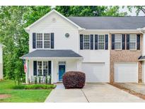 Charming two-story home with white siding, black shutters, and attached one-car garage at 727 Torrey Pines Ln, Fort Mill, SC 29715
