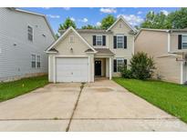 Charming two-story home featuring a white garage door, black shutters and a well-maintained front yard at 13413 Golden Apple Ct, Charlotte, NC 28215