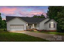 Charming one-story home with an attached garage and well-maintained front yard landscaping at 1377 Beagle Run, Salisbury, NC 28146