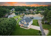 Stunning waterfront home with lush lawn, private dock, and scenic views at 2593 Las Brisas Ln, Denver, NC 28037