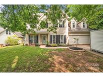 Charming two-story home with a well-manicured lawn and inviting front porch at 4502 Magnolia Ridge Dr, Waxhaw, NC 28173