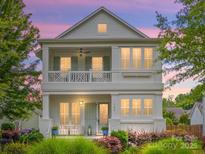 Stunning two-story home with a double porch, white exterior, and beautifully landscaped front yard at 790 Herrons Ferry Rd, Rock Hill, SC 29730