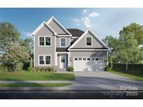 Charming two-story home featuring a well-maintained lawn, gray siding, and an attached two-car garage at Lot 50 Lavender Ln, Kannapolis, NC 28083