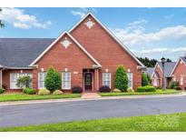 Charming brick home with manicured landscaping, offering curb appeal at 1302 Warrington Pl, Rock Hill, SC 29732