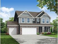 Charming two-story home featuring a three-car garage, stone accents, and classic architectural details at 2227 Caravan Ln # 43, Denver, NC 28164