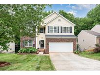 Charming two-story home with a well-manicured lawn and a two-car garage at 3236 Wicklow Ln, Clover, SC 29710