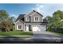 Charming two-story home with a well-manicured lawn and an attached two-car garage, perfect for modern living at Lot 51 Lavender Ln, Kannapolis, NC 28027