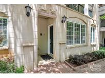Charming condo front entrance with well-lit access, complemented by large windows at 300 W 5Th St # 003, Charlotte, NC 28202