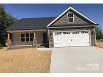 Beautiful single-Gathering home featuring stone accents, white garage door, and a welcoming front porch at 650 Fisher Dr # 3, Rockwell, NC 28138