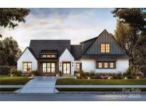 Stunning exterior view of a modern two-story home featuring a manicured lawn and contemporary design at 0000 Woodhill Cove Ln # 5, Denver, NC 28037