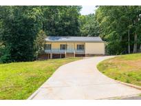 Charming, one-story home with a covered front porch and a long, inviting driveway at 103 Sycamore Rd, Salisbury, NC 28147