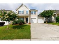 Charming two-story home with a well-maintained lawn and a two-car garage at 1148 Bannockburn Ave, Rock Hill, SC 29732