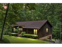 Charming single-story home with a wood exterior and lush green lawn at 460 27Th Avenue Nw Cir, Hickory, NC 28601