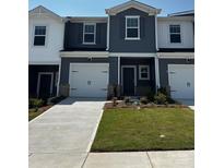 Charming new construction townhome featuring a one-car garage and beautifully landscaped front yard at 6118 Starview Ter, Charlotte, NC 28216