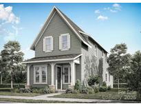 Charming two-story home featuring a welcoming front porch and traditional architectural details at 9113 Maybry Park St # Lot 116, Charlotte, NC 28212